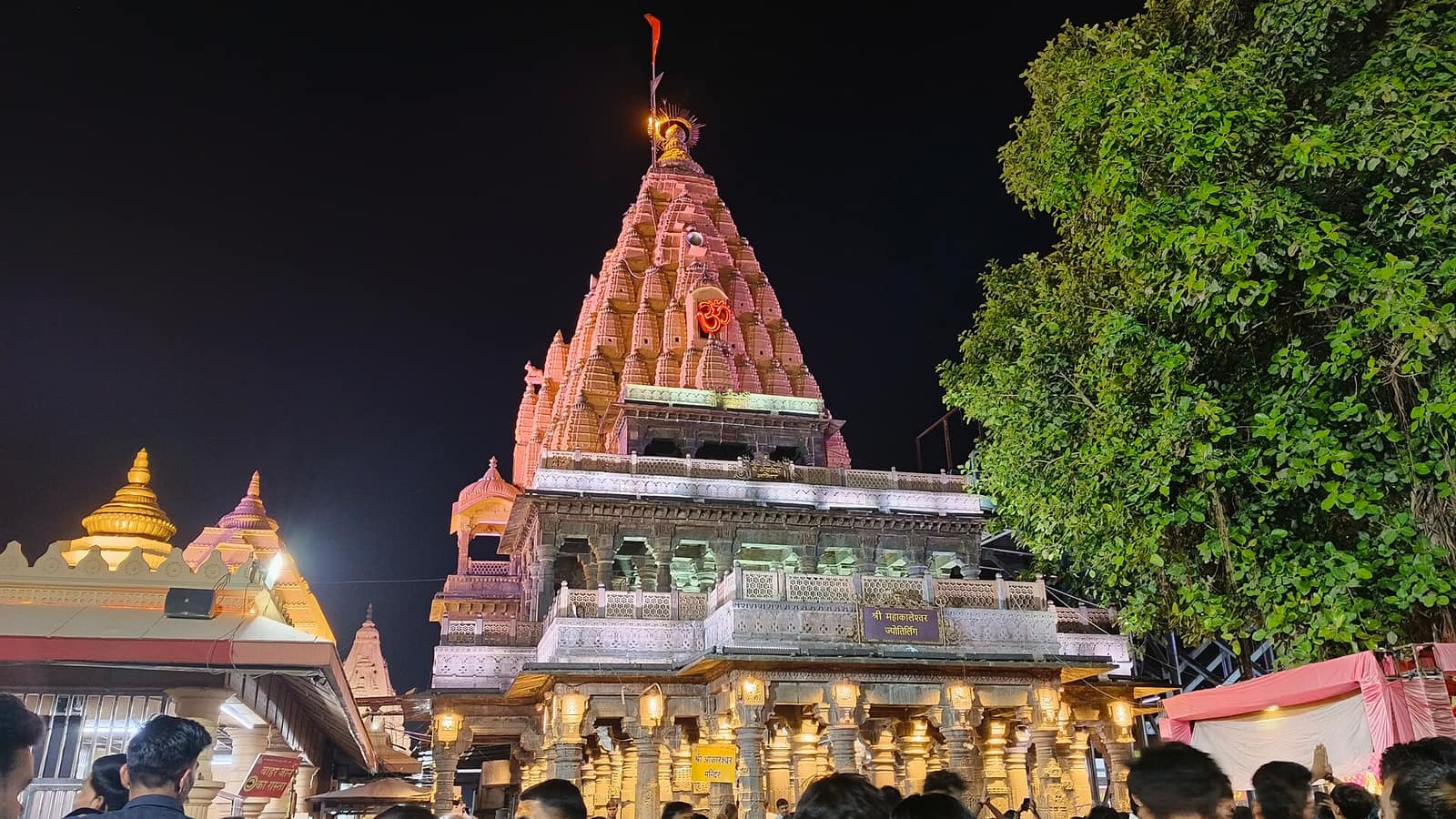 Mahakaleshwar Jyotirlinga temple lit up at night in Ujjain, Mahakal darshan package from Indore
