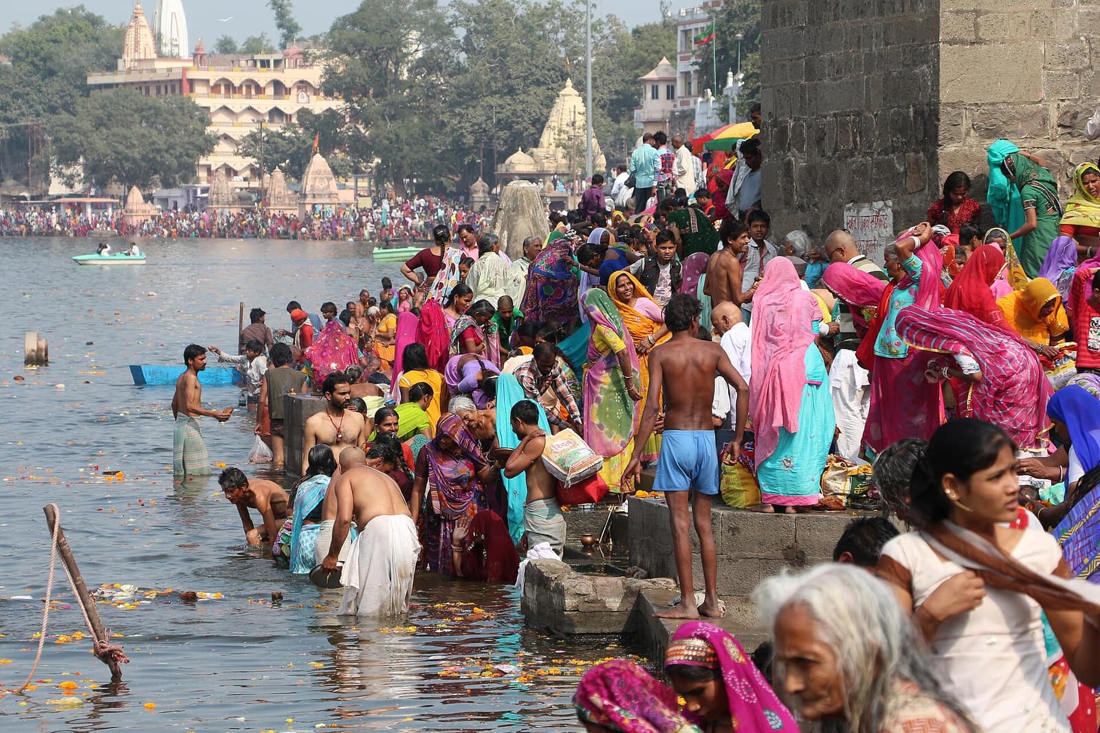 Devotees taking a holy dip at Ram Ghat on the Shipra river in Ujjain, twin Jyotirlinga darshan